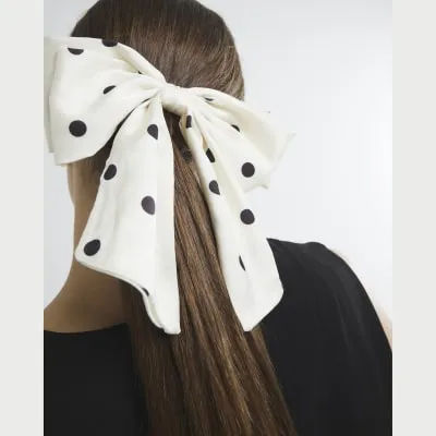 White Polka Dot Bow Hair Clip sold by River Island