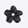 Black Flower Scrunchie sold by River Island