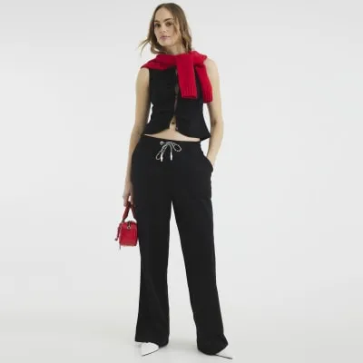 Black Sleeveless Button Through Ruched Top sold by River Island