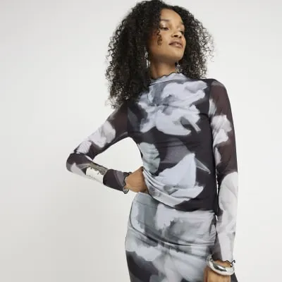 Black mesh floral long sleeve top sold by River Island