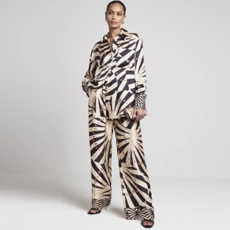 Beige satin stripe oversized shirt sold by River Island