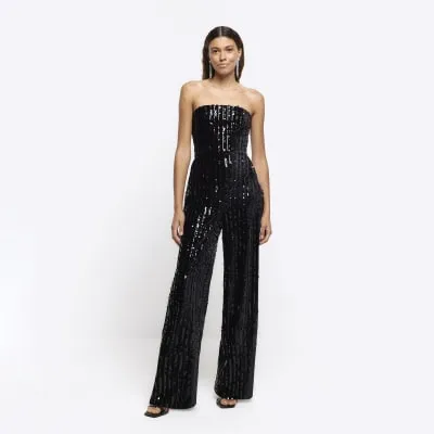 Black velvet sequin bandeau jumpsuit sold by River Island