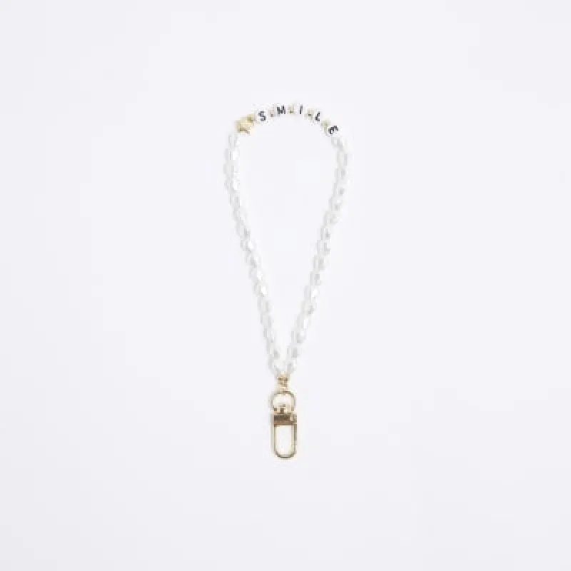 White Smile Pearl Phone Chain sold by River Island