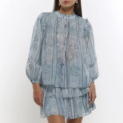 Blue abstract shirred blouse sold by River Island
