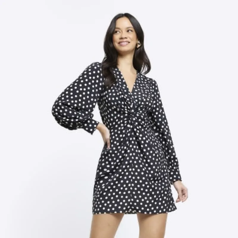 Black spot knot detail swing mini dress sold by River Island