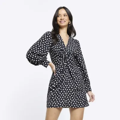 Black spot knot detail swing mini dress sold by River Island