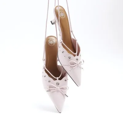 Pink eyelets lace up heeled court shoes sold by River Island