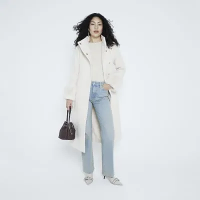 Brown cross body bucket bag sold by River Island