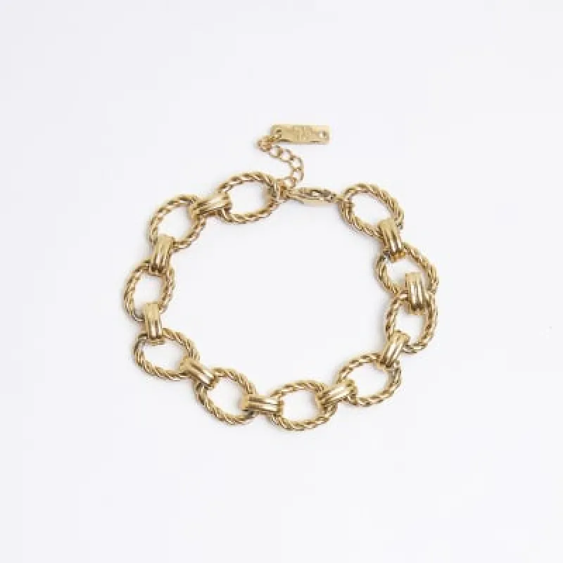 Gold Steel Link Bracelet sold by River Island