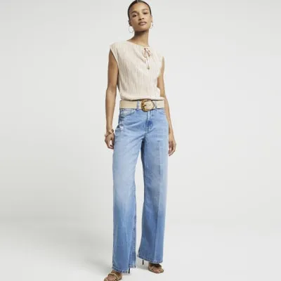 Beige plisse tie neck sleeveless top sold by River Island