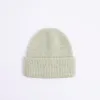 Green chunky knit beanie hat sold by River Island