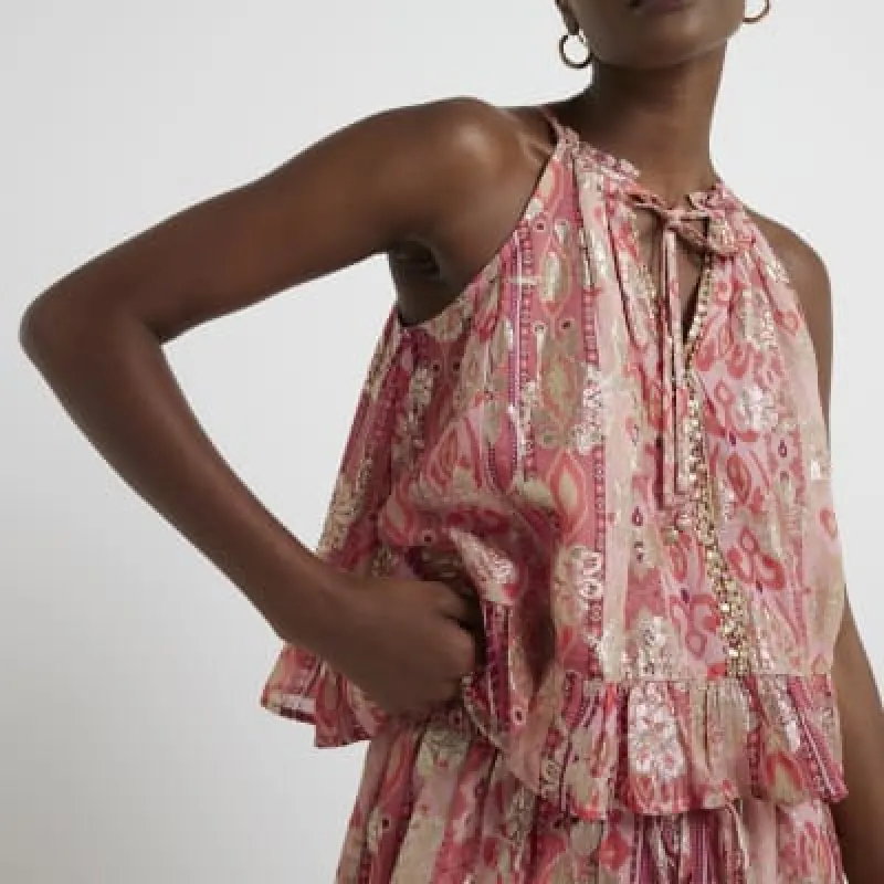 Red glitter halter neck top sold by River Island