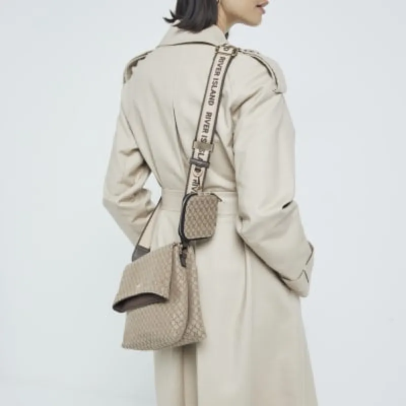 Brown monogram fold over cross body bag sold by River Island