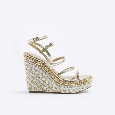 Gold strappy wedge sandals sold by River Island