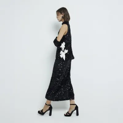 Black Sequin Pull On Midi Skirt sold by River Island
