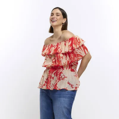 Plus red floral bardot blouse sold by River Island