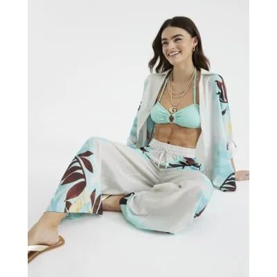 Blue floral geometric wide leg trousers sold by River Island