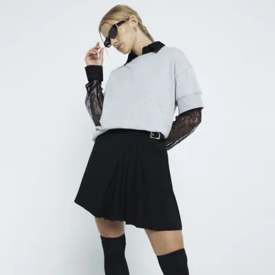 Black Crepe Belted Pleated Mini Skirt sold by River Island