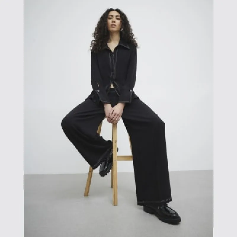 Black tailored trousers sold by River Island