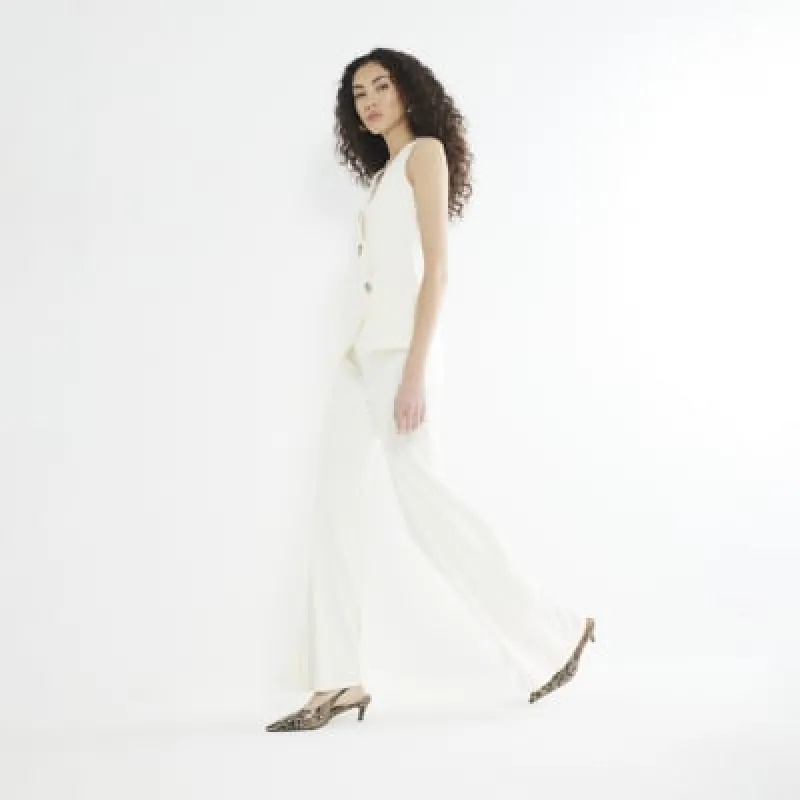 Cream Wide Leg Flare Trousers sold by River Island