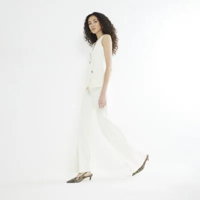 Cream Wide Leg Flare Trousers sold by River Island