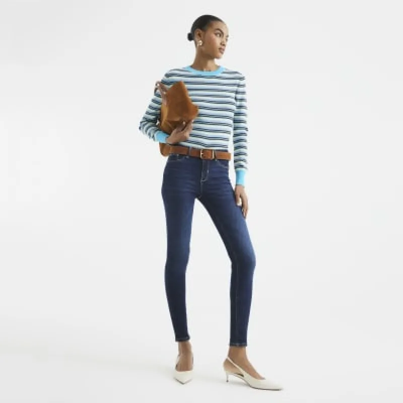 Blue mid rise molly sculpted jeans sold by River Island