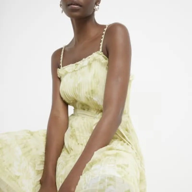 Yellow pleated floral shift midi dress sold by River Island