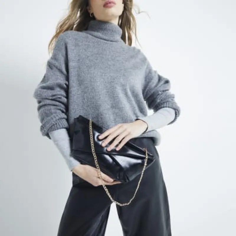 Black Patent Twist Front Clutch Bag sold by River Island