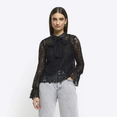 Black lace bow detail blouse sold by River Island