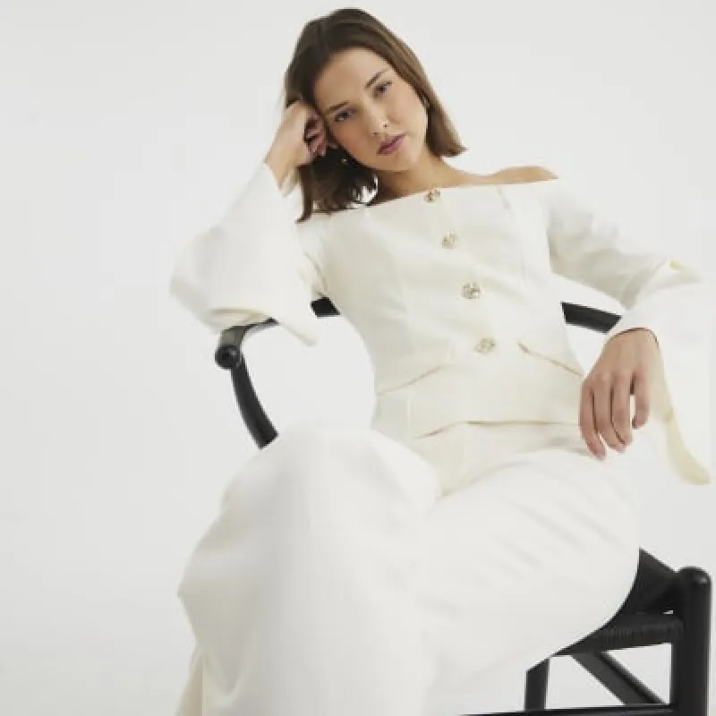 Cream scuba bardot off the shoulder jacket sold by River Island