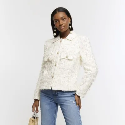 Cream textured crop trophy jacket sold by River Island