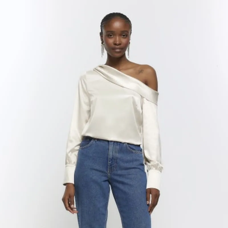 Beige satin off shoulder top sold by River Island