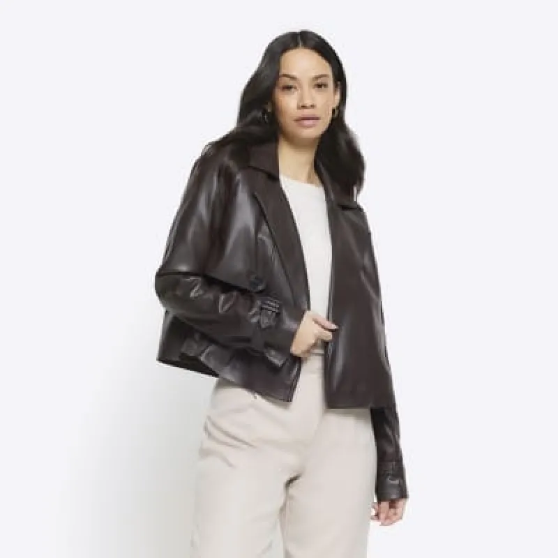 Brown cropped faux leather trench coat sold by River Island