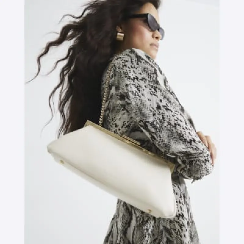 Cream Structured Clutch Bag sold by River Island
