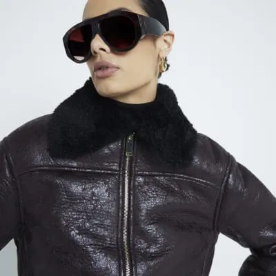 Brown faux leather bomber sold by River Island
