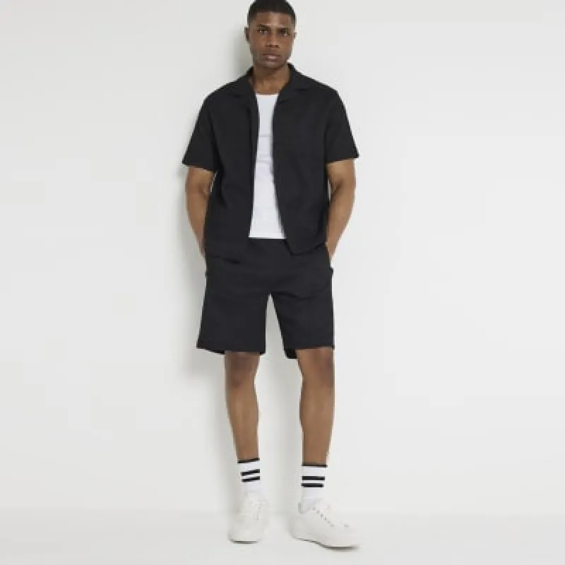 Black regular fit elasticated plisse shorts sold by River Island