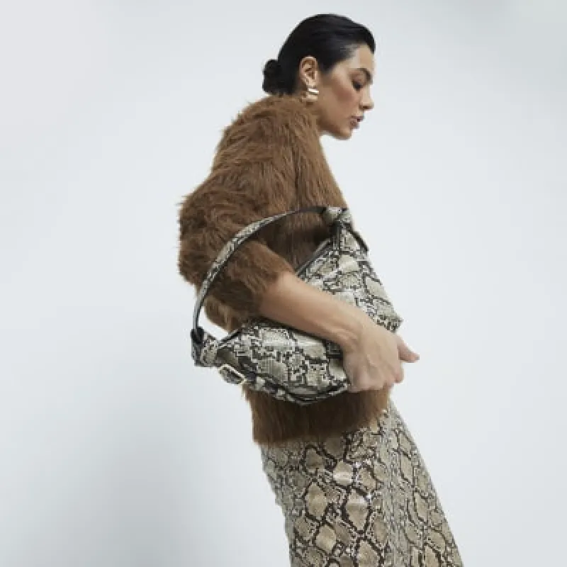 Beige Snake Print Shoulder bag sold by River Island