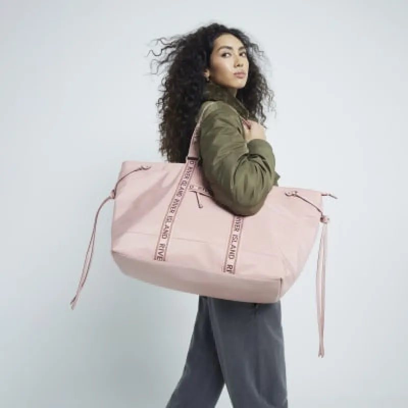 Pink Zip Luggage Bag sold by River Island