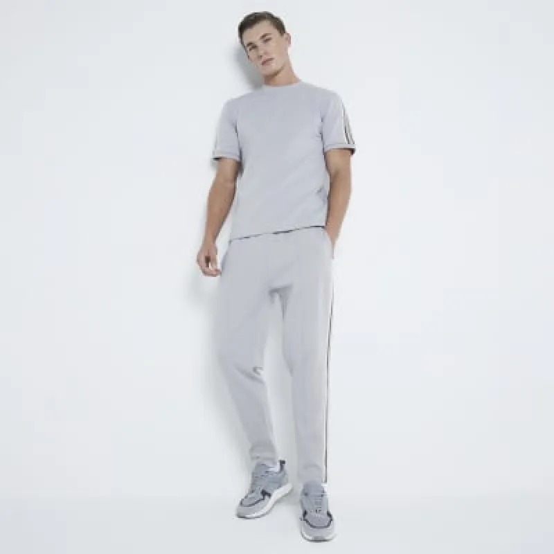 Stone Slim Fit Taped Joggers sold by River Island