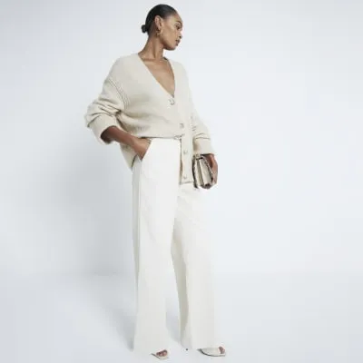 Stone faux leather wide leg trousers sold by River Island