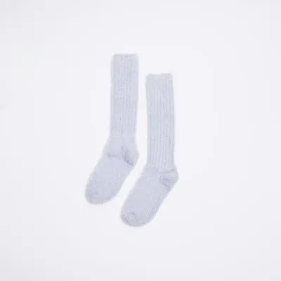 Purple Glitter Ribbed Fluffy Socks sold by River Island