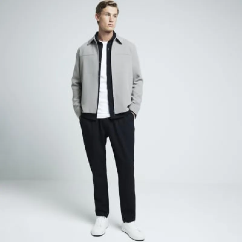 Black slim fit pleated smart joggers sold by River Island