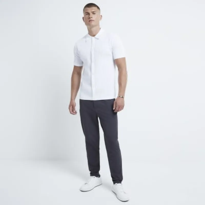 White muscle fit brick knit shirt sold by River Island