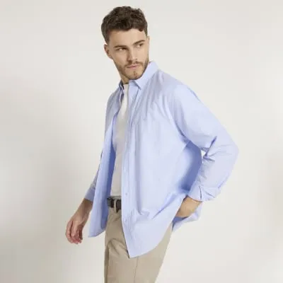 Blue regular fit long sleeve oxford shirt sold by River Island