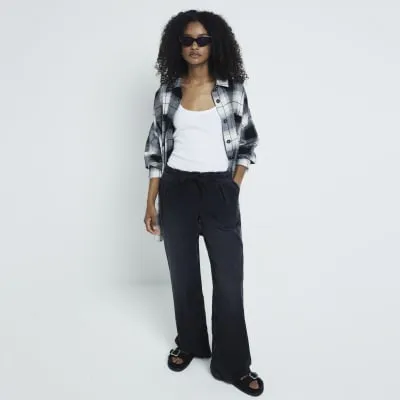 Black loose wide leg drawstring jeans sold by River Island