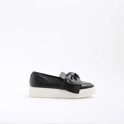Black Wide Fit Slip On Bow Trainers sold by River Island
