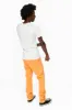 CLASSIC 5 POCKET  SLIM  LEG JEANS  IN PASTEL ORANGE sold by Robin's Jean