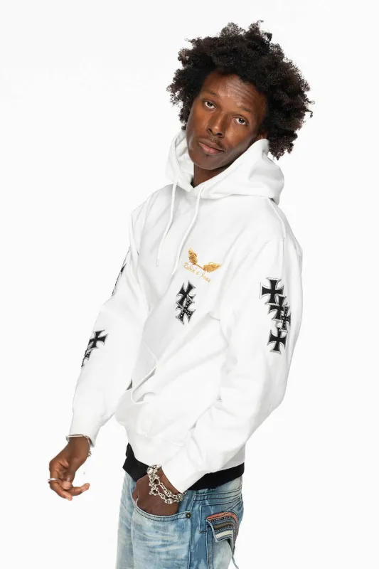 ROBIN’S JEAN PULLOVER HOODIE IN WHITE EMBELLISHED WITH MEDIEVAL CROSS PATCHES AND CRYSTALS sold by Robin's Jean