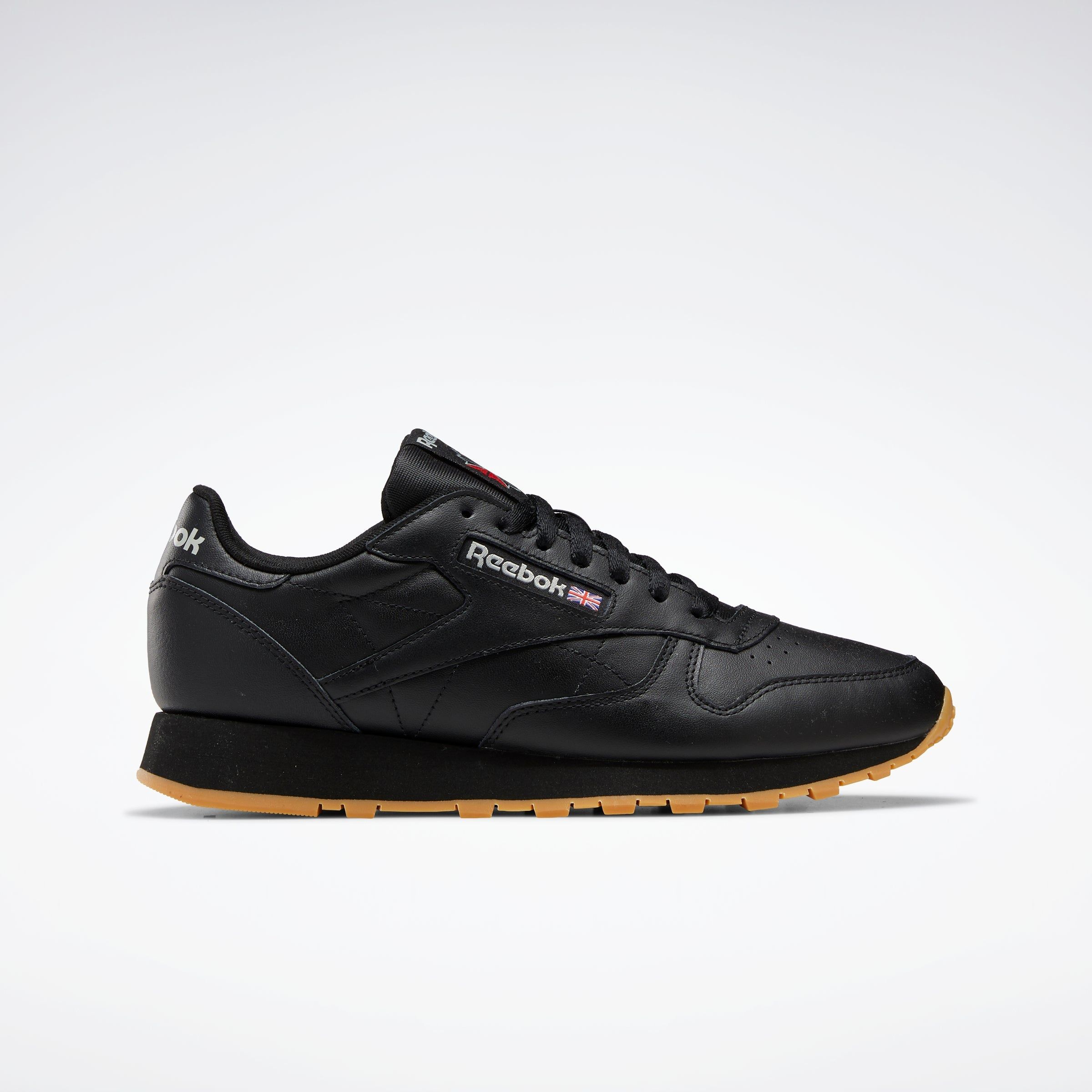 Reebok Footwear Men Classic Leather Shoes Cblack/Pugry5/Rbkg03 sold by Rockport