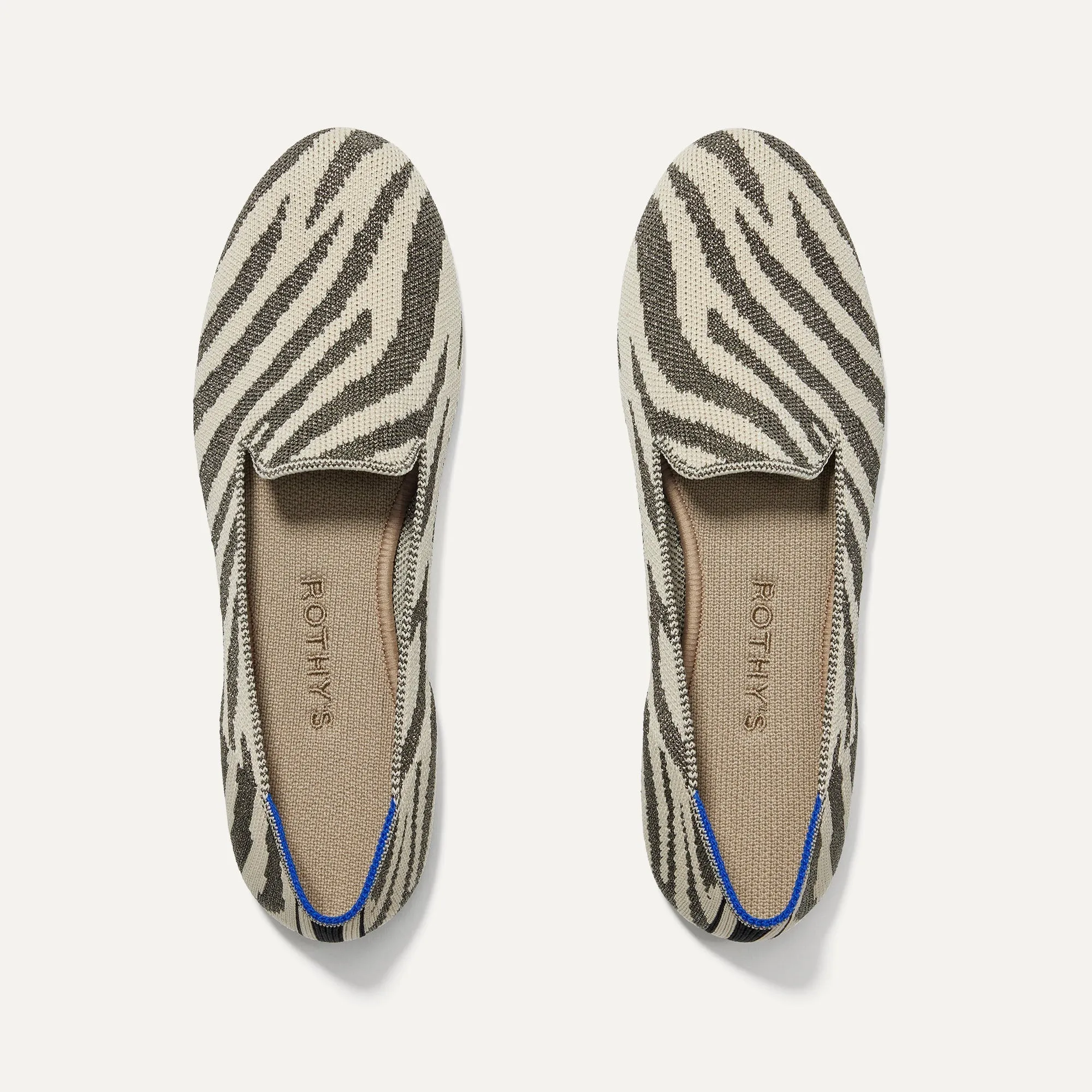The Loafer - Shimmer Zebra sold by Rothy's